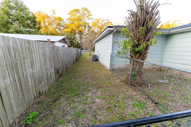 view of yard featuring central AC unit