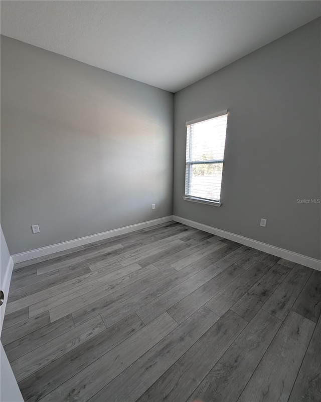 spare room with light hardwood / wood-style floors