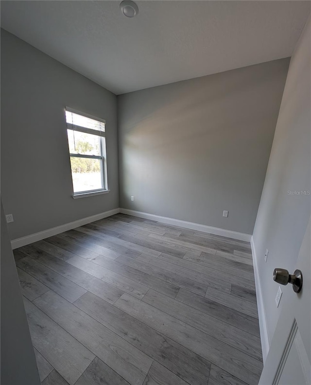 empty room with light hardwood / wood-style floors