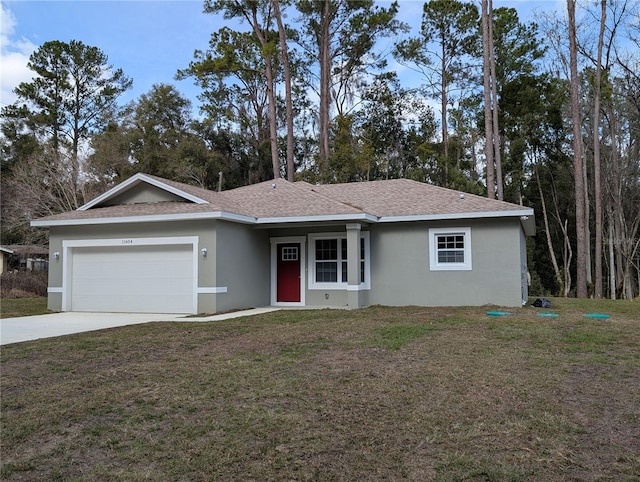 ranch-style house with a garage and a front yard