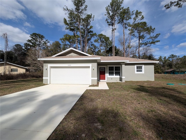 ranch-style house featuring a garage and a front yard