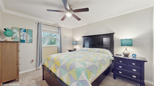 carpeted bedroom featuring crown molding and ceiling fan