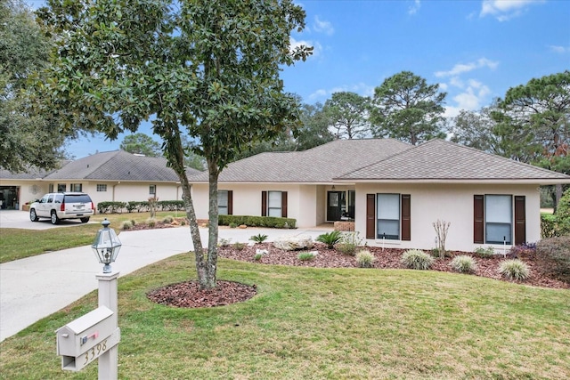 ranch-style house featuring a front lawn