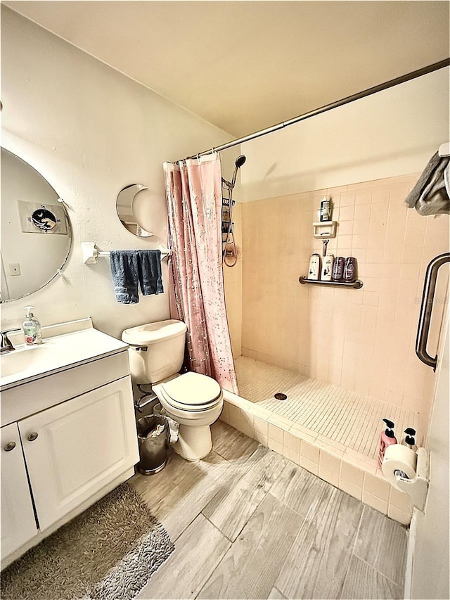 5625 SW 181st Ct, Dunnellon, FL 34432 - bathroom with a shower stall, vanity, and wood finished floors