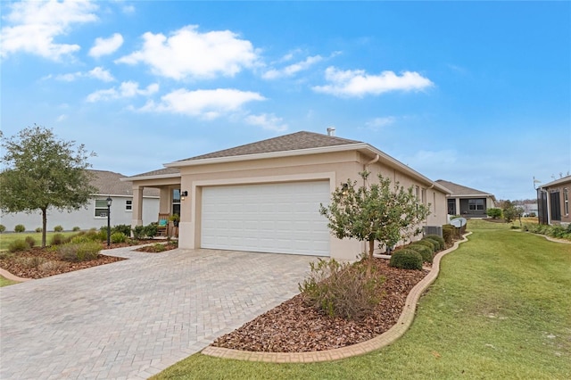 single story home with a garage and a front yard