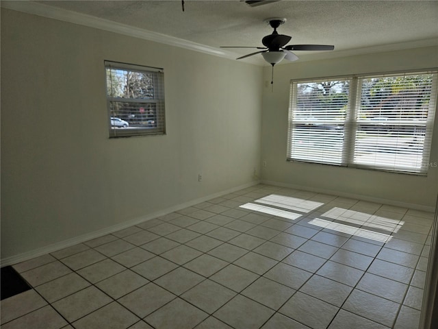 tiled spare room featuring crown molding, a textured ceiling, and ceiling fan