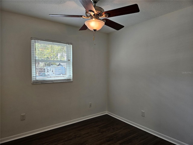 unfurnished room with dark hardwood / wood-style flooring, ceiling fan, and a textured ceiling