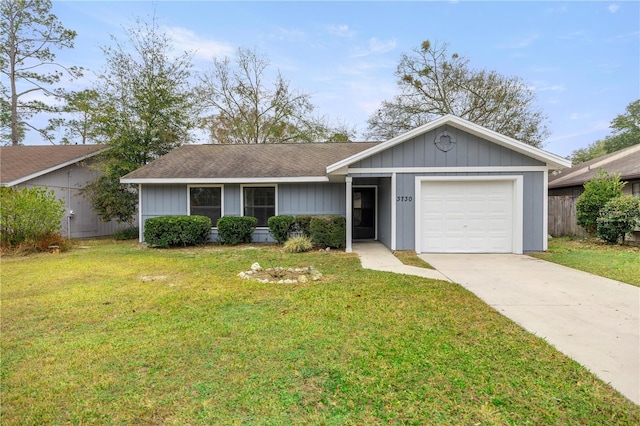 single story home featuring a garage and a front lawn