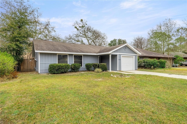 ranch-style home featuring a garage and a front yard