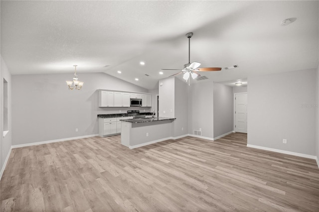 kitchen with appliances with stainless steel finishes, white cabinetry, light hardwood / wood-style floors, decorative light fixtures, and kitchen peninsula