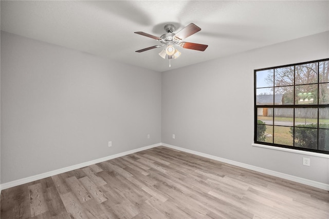 unfurnished room with ceiling fan and light wood-type flooring