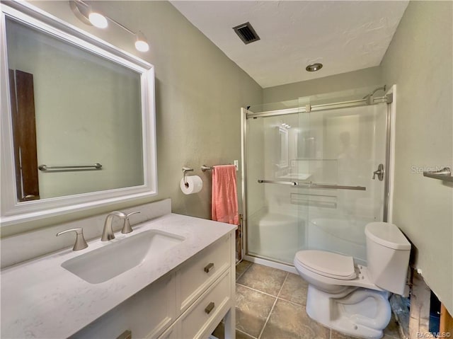 full bath featuring visible vents, toilet, tile patterned floors, vanity, and a shower stall