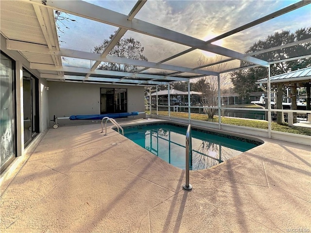 outdoor pool featuring a patio and a lanai