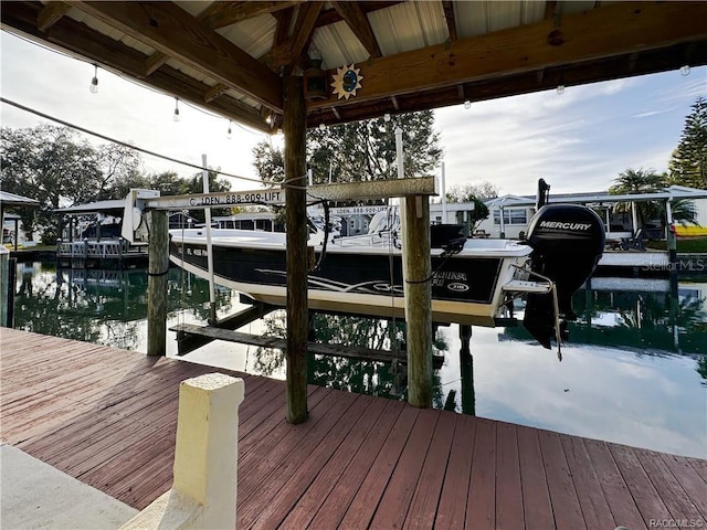 view of dock featuring a water view and boat lift