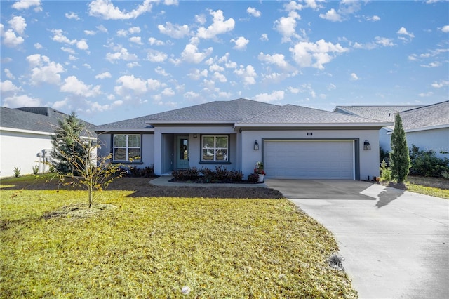 view of front facade featuring a garage and a front lawn