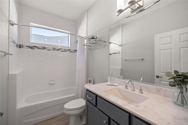 full bathroom with vanity, toilet, wood-type flooring, and shower / bath combo with shower curtain