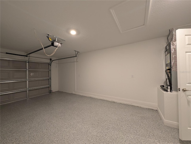 14259 SE 33rd Ter, Summerfield, FL 34491 - garage with baseboards and a garage door opener