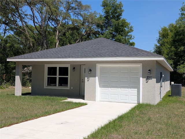 14259 SE 33rd Ter, Summerfield, FL 34491 - single story home with central AC unit, concrete driveway, an attached garage, a front yard, and stucco siding