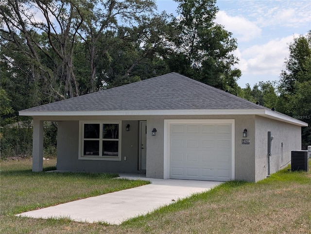 14259 SE 33rd Ter, Summerfield, FL 34491 - single story home featuring a shingled roof, a front lawn, and stucco siding