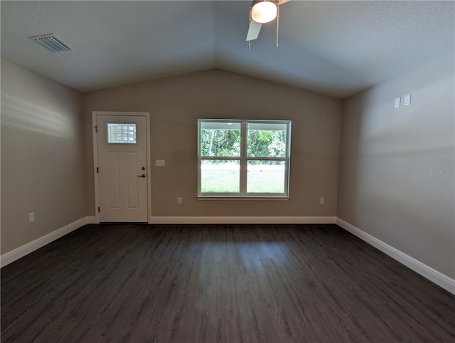 14259 SE 33rd Ter, Summerfield, FL 34491 - interior space with dark wood-style flooring, vaulted ceiling, baseboards, visible vents, and ceiling fan
