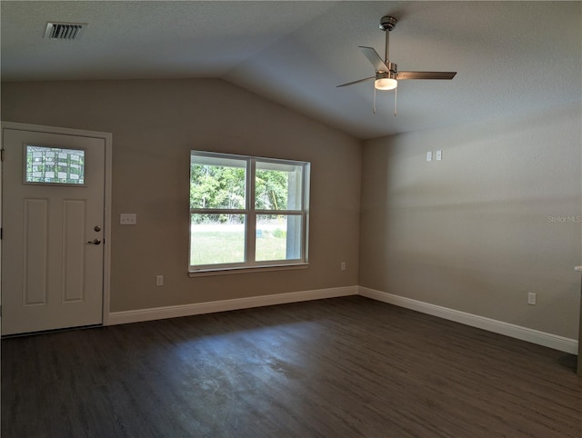 14259 SE 33rd Ter, Summerfield, FL 34491 - foyer entrance with dark wood-style flooring, vaulted ceiling, baseboards, visible vents, and ceiling fan
