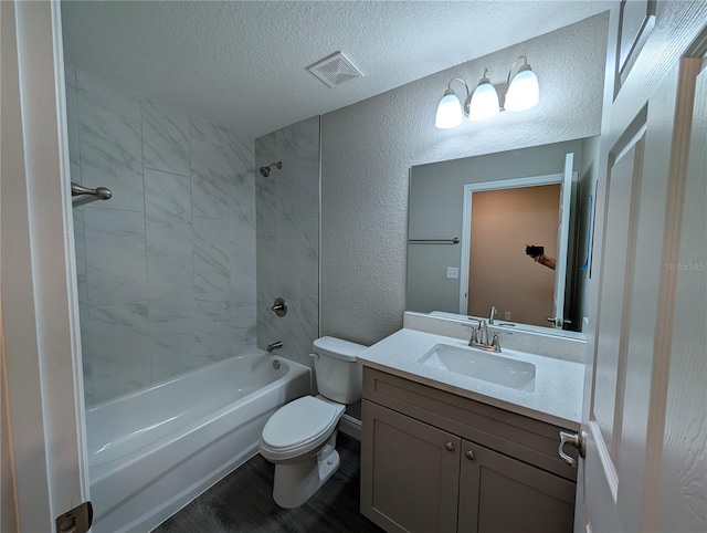 14259 SE 33rd Ter, Summerfield, FL 34491 - full bath with toilet, a textured wall, vanity, and a textured ceiling