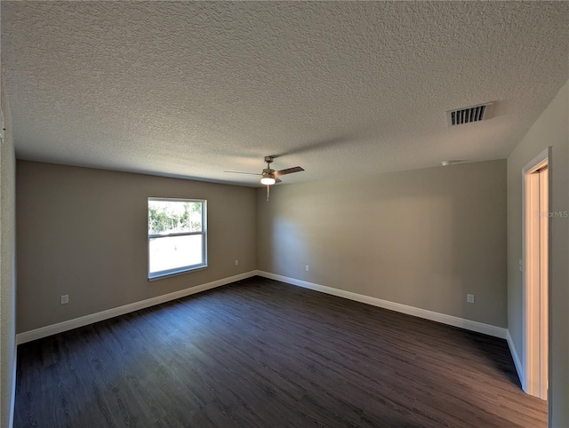 14259 SE 33rd Ter, Summerfield, FL 34491 - empty room featuring dark wood finished floors, visible vents, and a textured ceiling