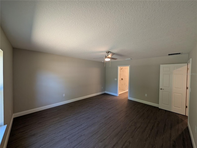 14259 SE 33rd Ter, Summerfield, FL 34491 - unfurnished room featuring a textured ceiling, dark wood-style flooring, baseboards, visible vents, and a ceiling fan