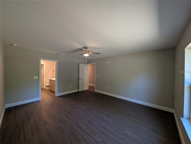 14259 SE 33rd Ter, Summerfield, FL 34491 - empty room with baseboards, a textured ceiling, ceiling fan, and dark wood finished floors