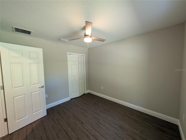 14259 SE 33rd Ter, Summerfield, FL 34491 - unfurnished bedroom featuring baseboards, visible vents, a closet, and dark wood-style flooring