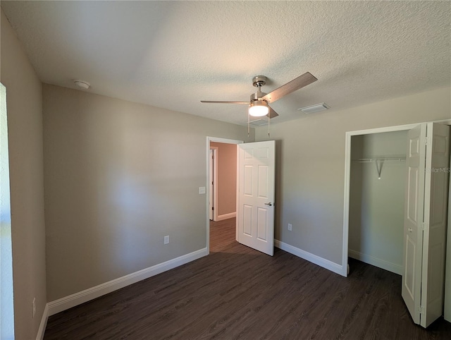 14259 SE 33rd Ter, Summerfield, FL 34491 - unfurnished bedroom with baseboards, visible vents, dark wood-style floors, and a closet