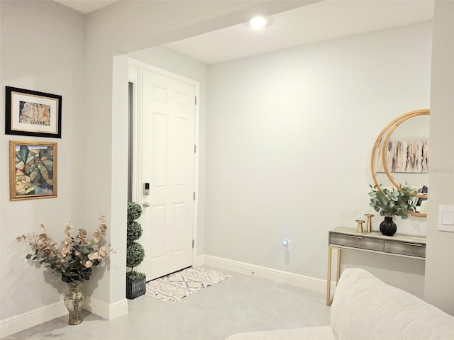 entryway with light tile patterned flooring