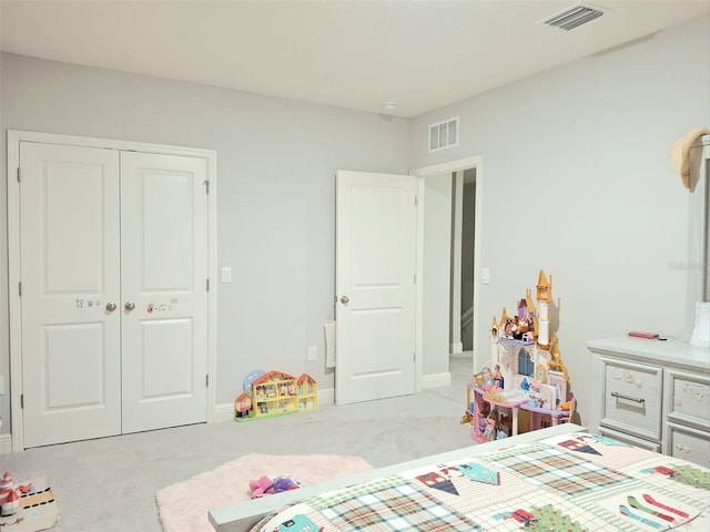 carpeted bedroom with a closet