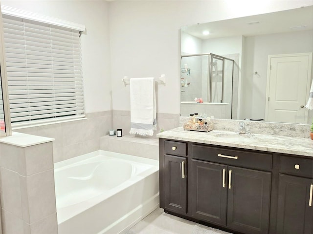 bathroom with plus walk in shower and vanity