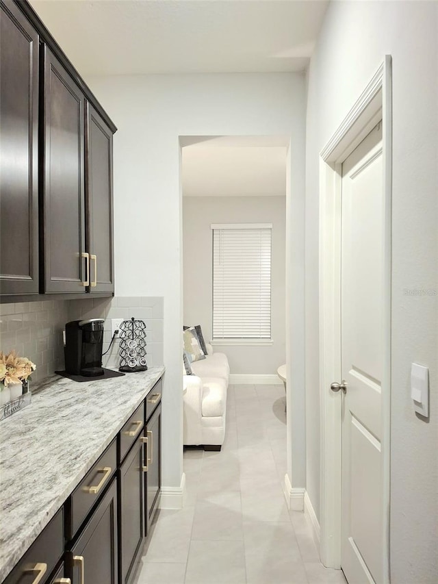 interior space with tasteful backsplash and tile patterned flooring