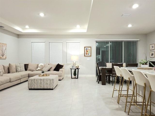 living room with a raised ceiling