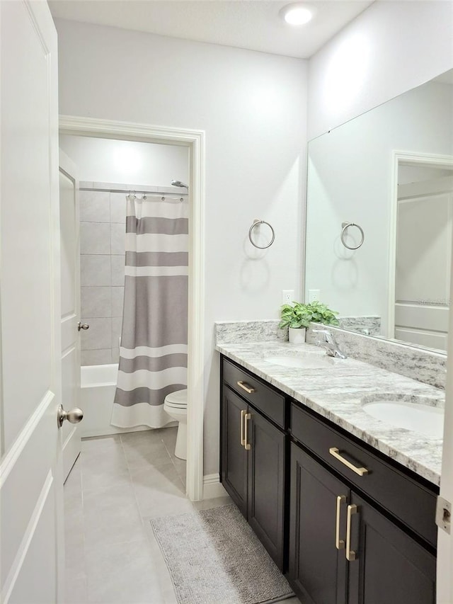 full bathroom featuring shower / bath combination with curtain, tile patterned floors, vanity, and toilet