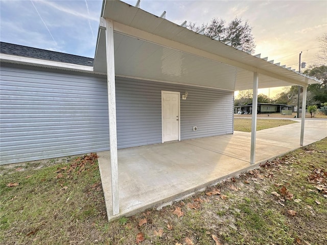 patio terrace at dusk with a carport