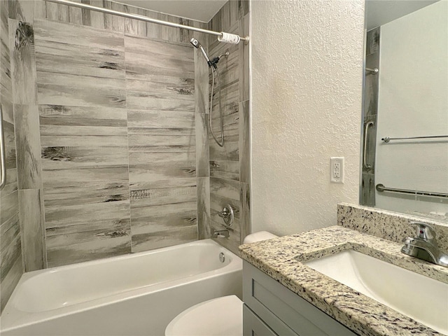 full bathroom featuring vanity, toilet, and tiled shower / bath combo