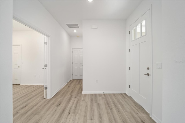 foyer entrance with light hardwood / wood-style floors