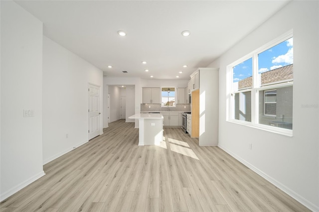 unfurnished living room with light wood-type flooring