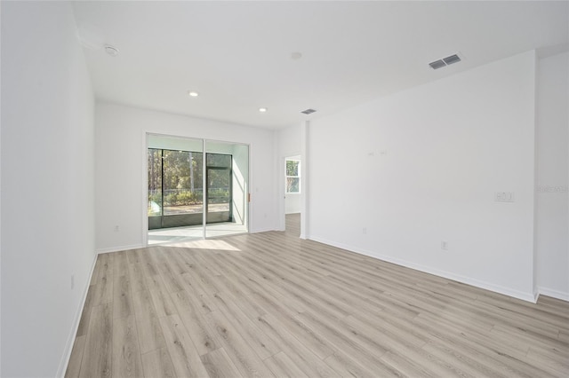 unfurnished room with light wood-type flooring