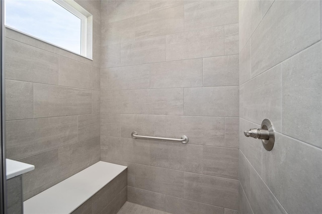 bathroom featuring a tile shower