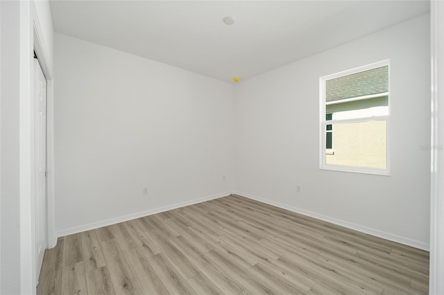 unfurnished room with light hardwood / wood-style flooring