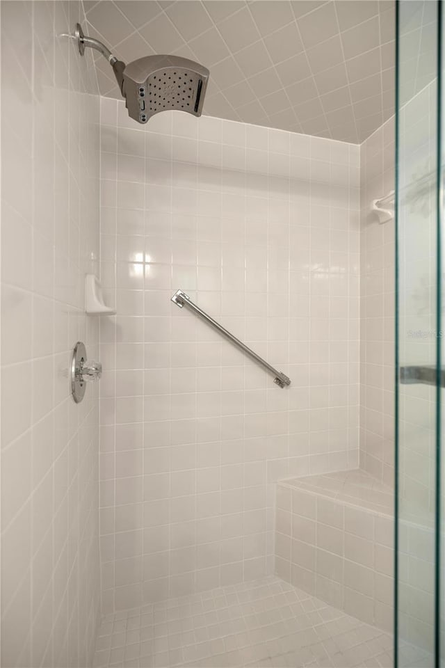 bathroom with a tile shower