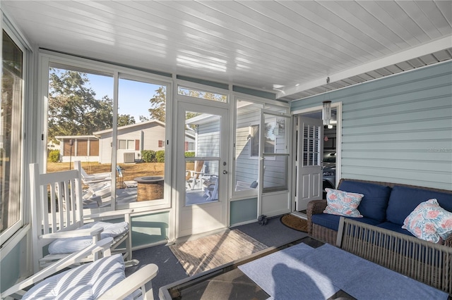 sunroom / solarium with wood ceiling