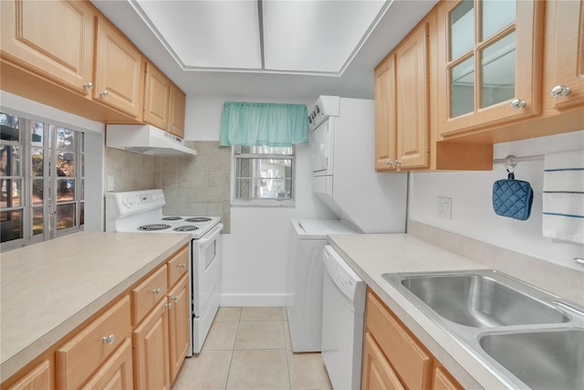 kitchen with sink, white appliances, a wealth of natural light, and decorative backsplash