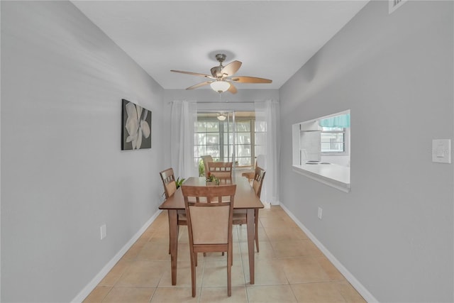 dining room featuring light tile patterned flooring and ceiling fan