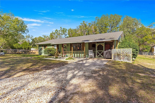 ranch-style house with covered porch