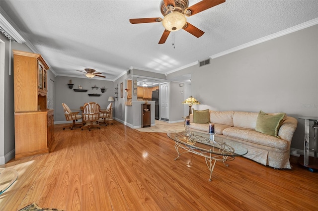 living room featuring light hardwood / wood-style flooring and ornamental molding